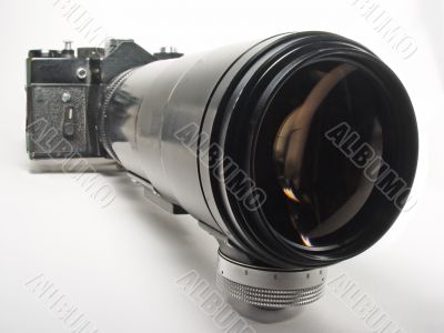 old photocamera with big objective