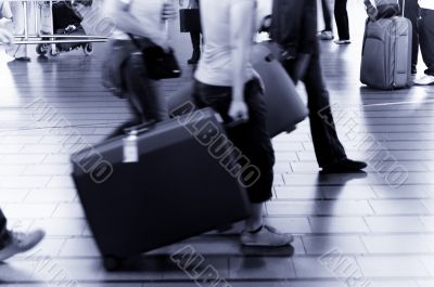 people traveling at the airport