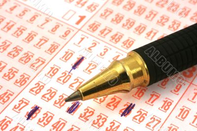 lottery ticket and pen