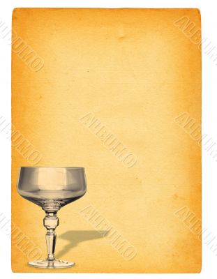 champagne glass against paper