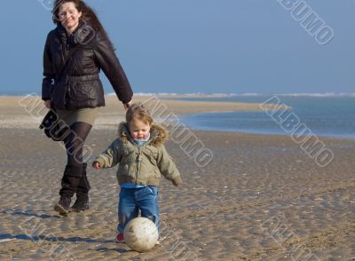 happy mother and her son on the beach