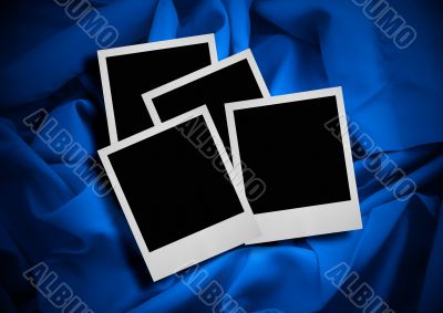 photo frames against textile background