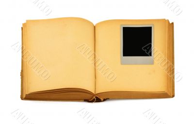old book with empty photo frame inside