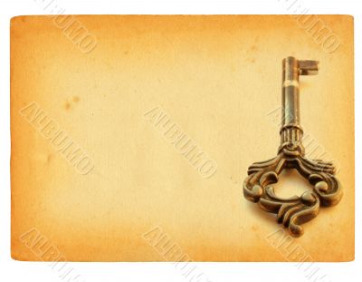 old sheet of paper with key motif