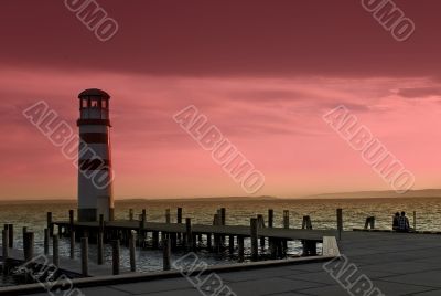 Two people sitting at a lighthouse