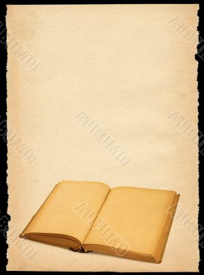torn out old sheet of paper with open book