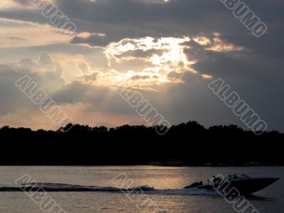 speedboat at sunset