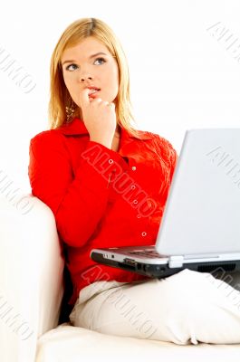 Women with laptop on couch
