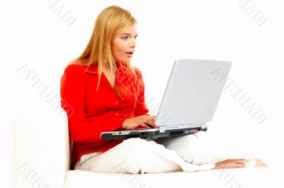 Women with laptop on couch