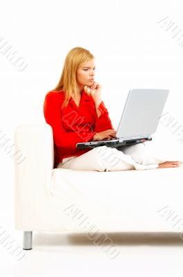 Women with laptop on couch