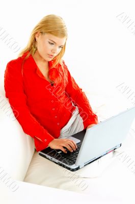 Women with laptop on couch