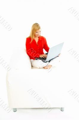 Women with laptop on couch