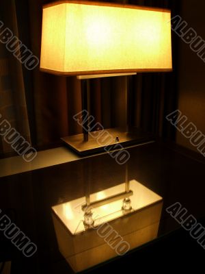 Lamp reflected in desk