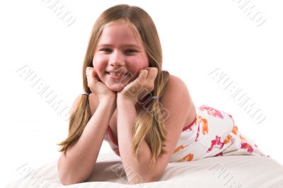 Pretty blond girl lying on a couch