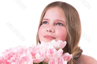 Beautiful little girl with pink tulips