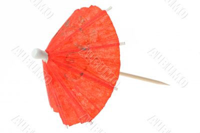 red asian cocktail umbrella on white