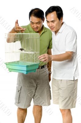 Looking At Birds In Cage