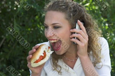 Businesswoman; taking a healthy bite