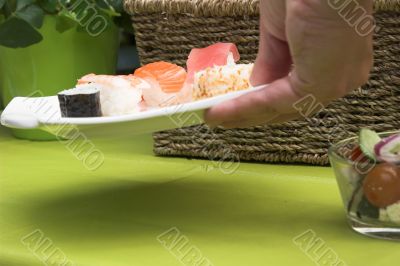 Putting down the sushi plate