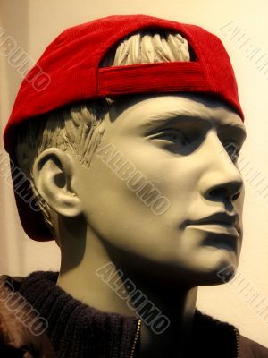 Shop mannequin with red cap