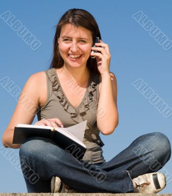 girl taking notes