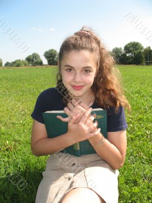 The smile girl with a book