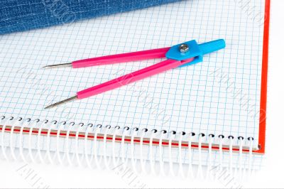 Compass over a notebook