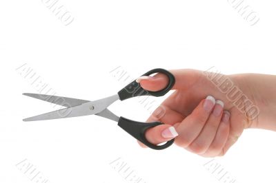 female hand holding scissors