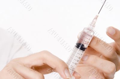 Hands and Syringe