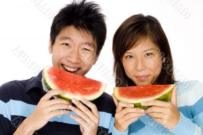 Couple Eating Melon