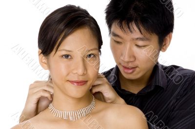 Putting on necklace