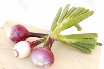 red onions on cutting board