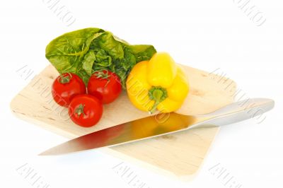 vegetables and knife on cutting board