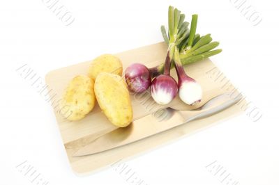potatoes and onions on white