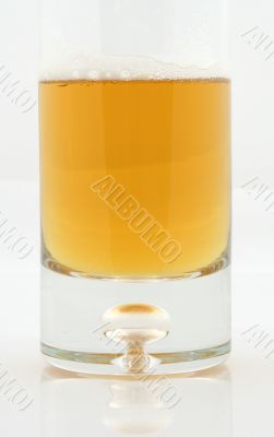 beer in glass on grey