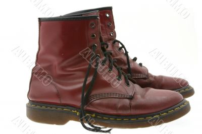 worn boots on white
