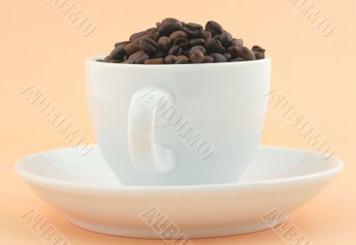 cup of full of coffee beans