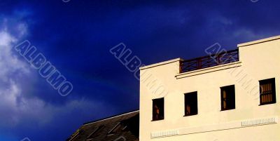 Light coloured building and deep blue sky
