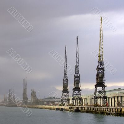 Three cranes at dockside
