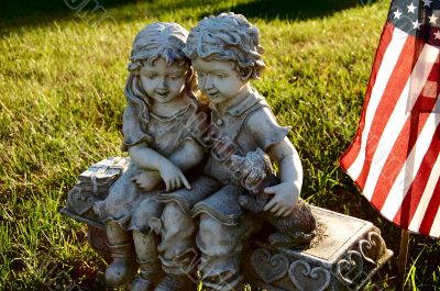 children and puppy statue