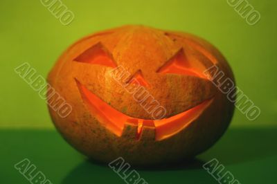 halloween pumpkin on green background