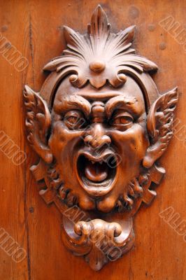 demon face door carving
