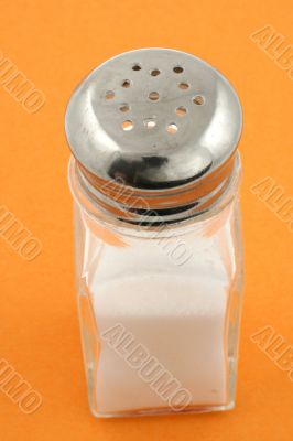 saltshaker on orange background