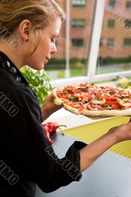Young Woman with Fresh Pizza