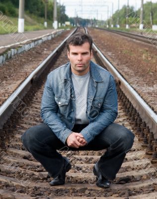 man against tracks