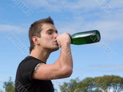man drinks wine