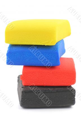pile of colorful plasticine blocks on white
