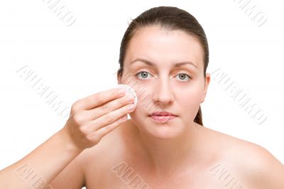 girl cleansing her face