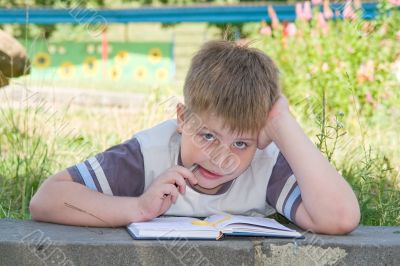 boy writes to writing-books