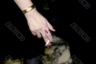 Hand of the woman smoking a cigarette
